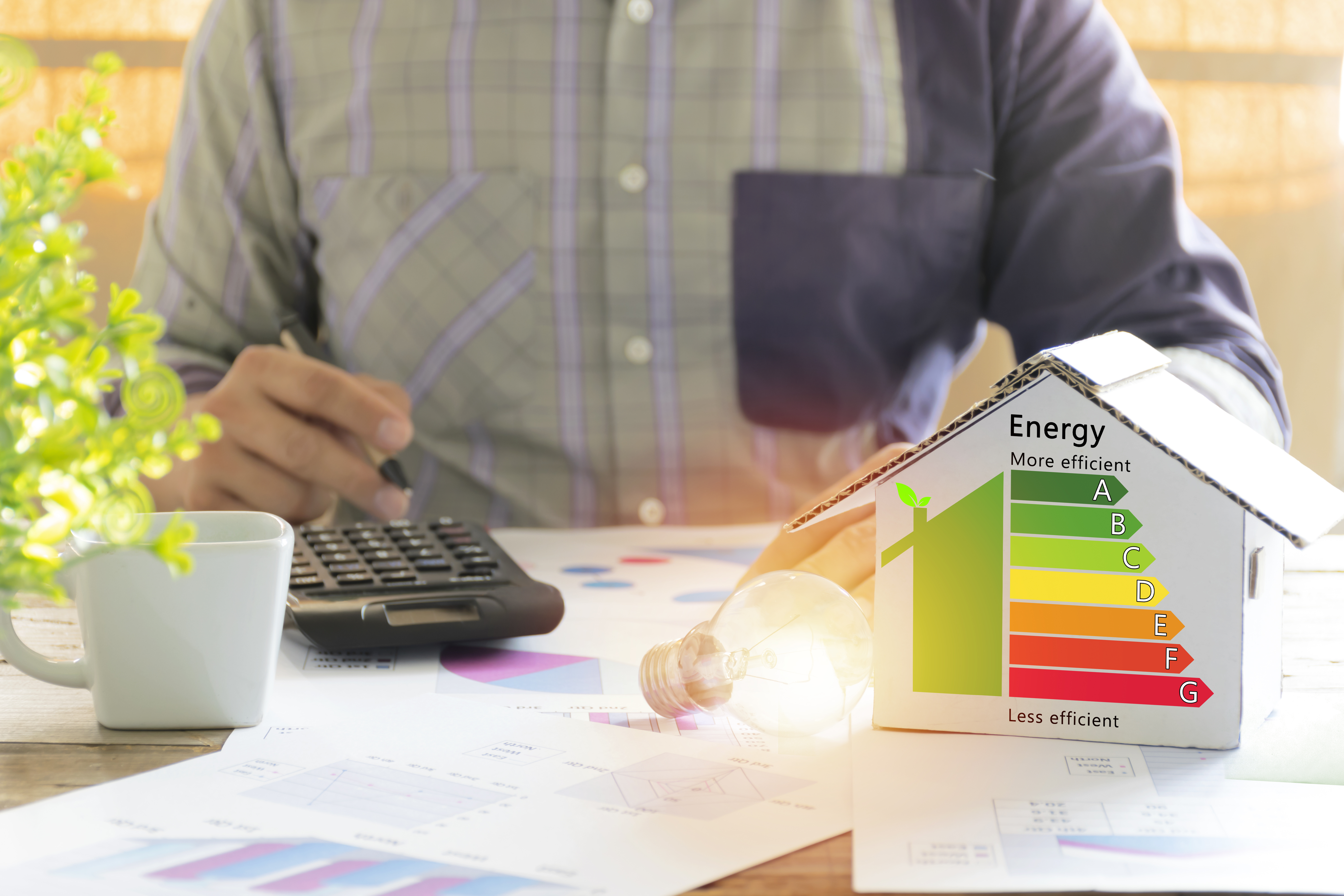 A technician performing an energy audit on a home.