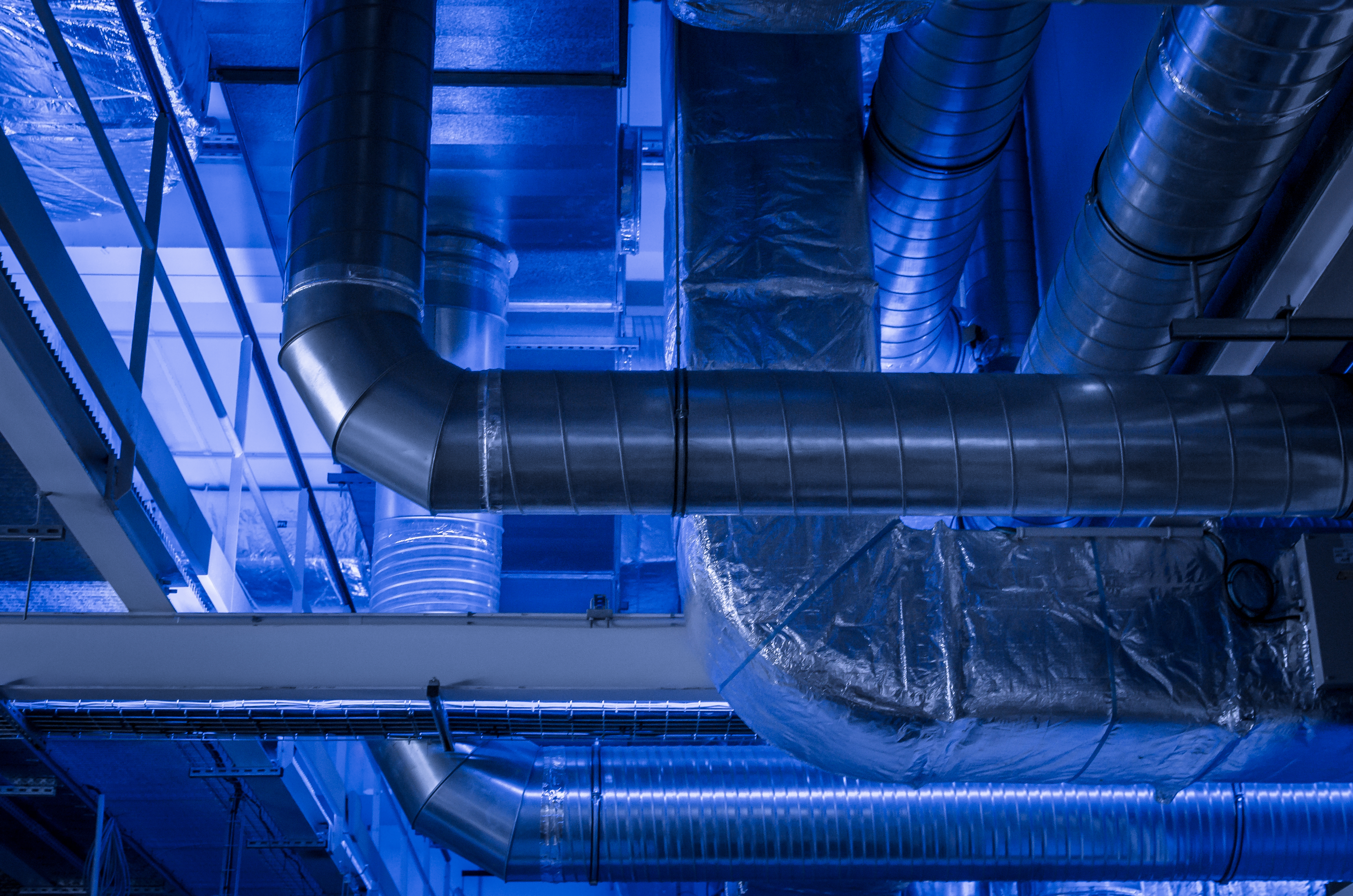 A technician installing an HVAC unit in a home.